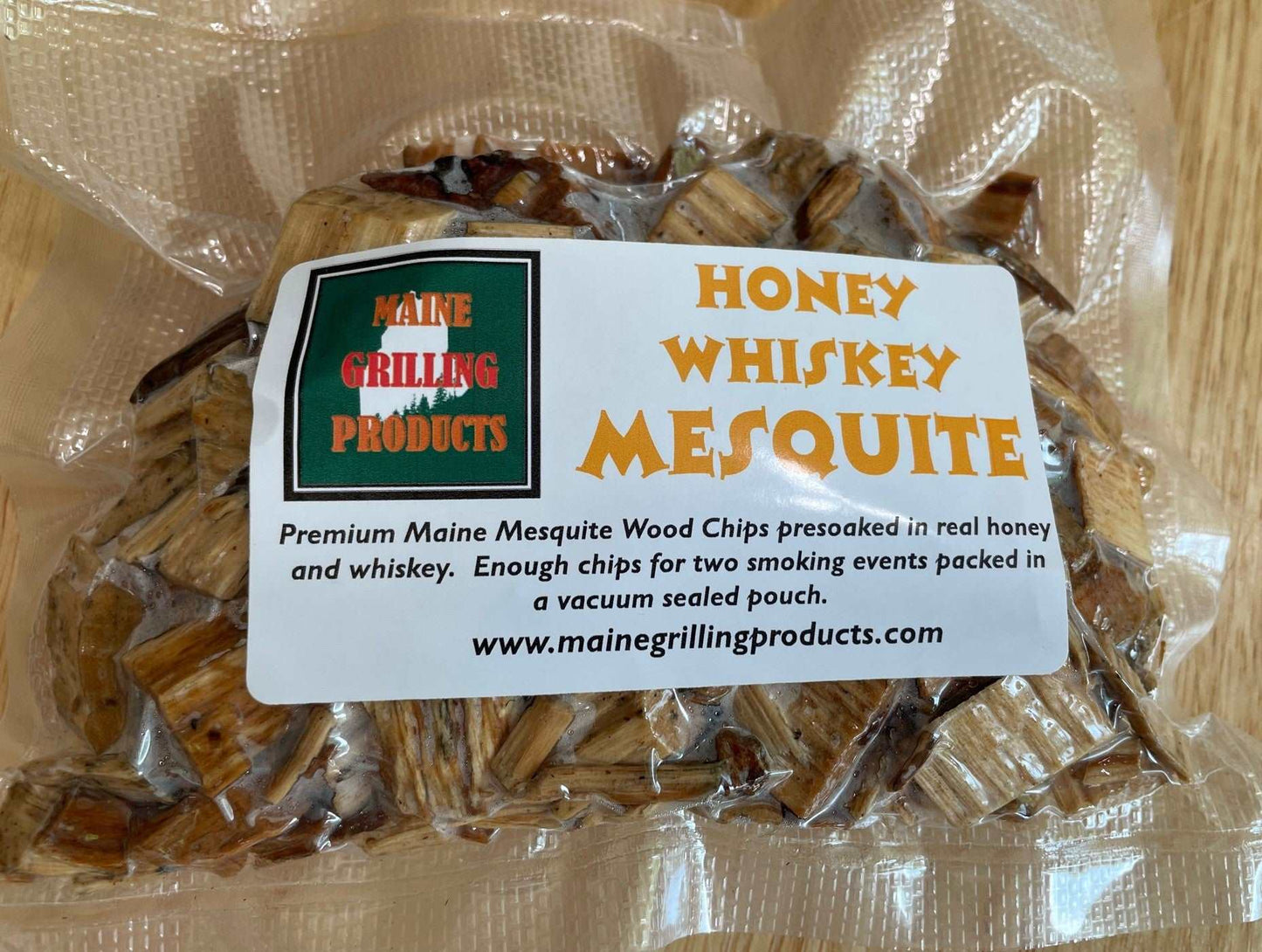 FOUR (6 OZ POUCHES) PRE-SOAKED MAINE HONEY WHISKEY MESQUITE WOOD CHIPS by Flame Grilling Products Inc