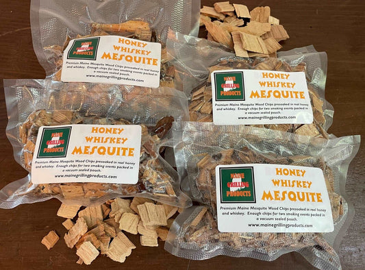 FOUR (6 OZ POUCHES) PRE-SOAKED MAINE HONEY WHISKEY MESQUITE WOOD CHIPS by Flame Grilling Products Inc